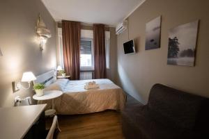 Postel nebo postele na pokoji v ubytování CconfortHotels R&B Cavour