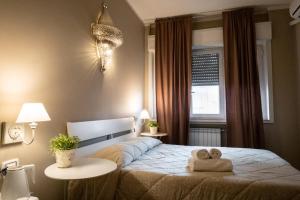 Postel nebo postele na pokoji v ubytování CconfortHotels R&B Cavour