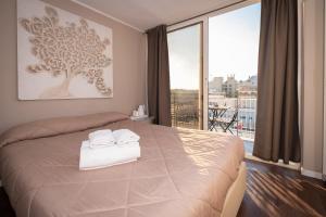 Postel nebo postele na pokoji v ubytování CconfortHotels R&B Cavour