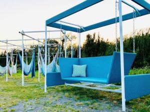 a blue swing set in a yard with at GRAN BLUE - Vacation STAY 11224v in Minamiboso