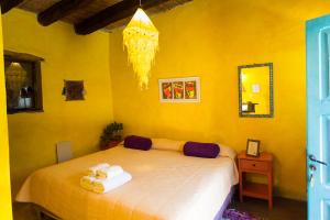 
Una cama o camas en una habitación de Viracocha Art Hostel Cachi
