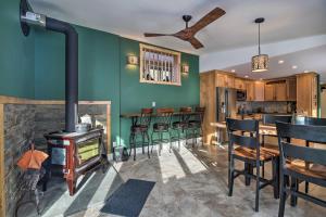 a living room with a fireplace and a stove at Cozy Home with Sauna Mins to Stowe Mountain Resort in Stowe