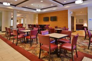 a large dining room with tables and chairs at Holiday Inn Express & Suites Pittsburg by IHG in Pittsburg