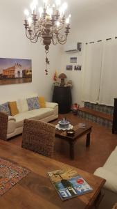 a living room with a couch and a table at Casa del Parlamento in Palermo