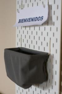 a black vase on a wall with a sign on it at Hotel Saueth in Tredós