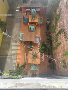 an overhead view of a patio with tables and chairs at Casa Imagine in Santa Marta