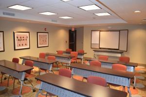 a classroom with tables and chairs and a screen at Staybridge Suites Bowling Green by IHG in Bowling Green +66 photos