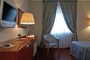 Postel nebo postele na pokoji v ubytování Hotel Del Campo