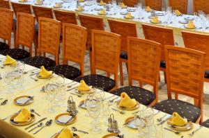 a group of tables with hats on top of them at KAKTUS Hotel Kaktus Albir in Albir