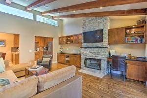 a living room with a couch and a fireplace at Dtwn Palm Springs Condo BBQ, Pool, Fire Pit, etc! in Palm Springs