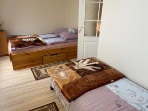 Posteľ alebo postele v izbe v ubytovaní Bursztynek