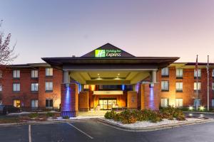 a hotel with a sign on the front of a building at Holiday Inn Express Hotel & Suites Dayton-Centerville by IHG in Centerville