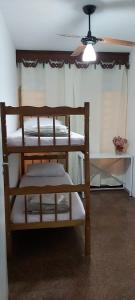 Una cama o camas en una habitación de Pousada da Cléo