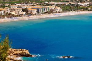 an aerial view of a beach with hotels and buildings at KAKTUS Hotel Kaktus Albir in Albir