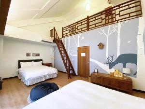 Postel nebo postele na pokoji v ubytování Reindeer Miaoli Green Wave