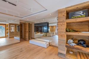 a room with wooden walls and wooden floors at Chalet Les Meuniers in Megève