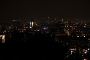 a view of a city at night with lights at Hollywood Hills Hotel in Los Angeles