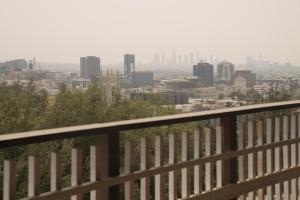 a view of a city from a balcony at Hollywood Hills Hotel in Los Angeles