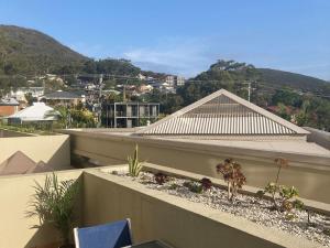 a building with plants on the ledge of a roof at 101 The Breakwater 2 Messines - Linen, Wifi, Air con in Shoal Bay
