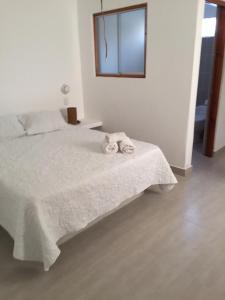 Postel nebo postele na pokoji v ubytování Origenes Spa & Lodging