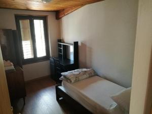 Ein Bett oder Betten in einem Zimmer der Unterkunft Casa Renzo - Dolomiti - Trentino