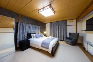 The Castle by Hakuba Hospitality Group tesisinde bir odada yatak veya yataklar