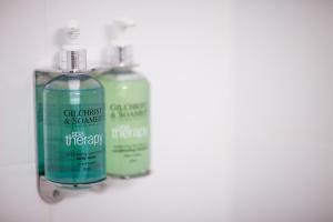 two bottles of cleaning products sitting next to each other at Leonardo Hotel Aberdeen in Aberdeen