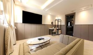 TV a/nebo společenská místnost v ubytování H moment Hotel songjeong