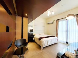 Кровать или кровати в номере Ai Lian Shan Shui Homestay