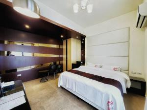 Кровать или кровати в номере Ai Lian Shan Shui Homestay