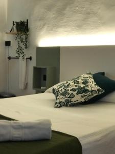 Postel nebo postele na pokoji v ubytování Hostal l'Estrella