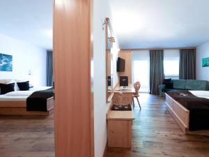 Letto o letti in una camera di Hotel Alpin