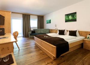 Letto o letti in una camera di Hotel Alpin