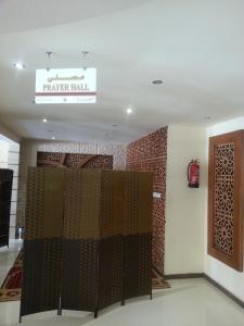 a room with a gate and a sign that reads prayer hall at Dorar Darea Hotel Apartments- Al Malqa 2 in Riyadh