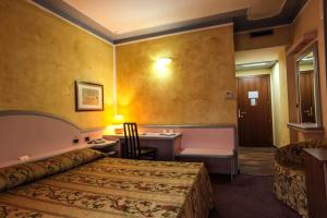 Postel nebo postele na pokoji v ubytování Hotel Grazia Deledda