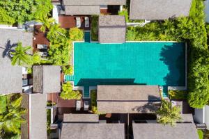 an aerial view of a villa with a swimming pool at Anantara Lawana Koh Samui Resort in Chaweng