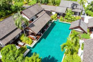 an aerial view of a villa with a swimming pool at Anantara Lawana Koh Samui Resort in Chaweng