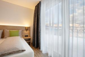 Llit o llits en una habitació de Hotel Tannenboden