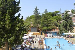 a group of people in a swimming pool at Camping Sènia Cala Canyelles in Lloret de Mar