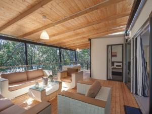 a living room with a couch and a table at Camping Homes Mon Perin in Bale