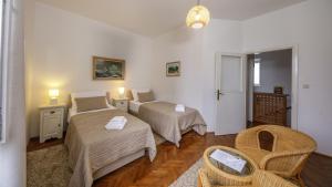 Postel nebo postele na pokoji v ubytování Villa Bruna