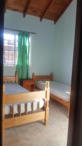 En eller flere senge i et værelse på Triplex 3 habitaciones