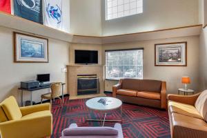 a living room filled with furniture and a fireplace at Econo Lodge North Academy in Colorado Springs