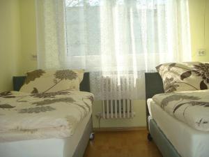 Łóżko lub łóżka w pokoju w obiekcie Hostel Omega