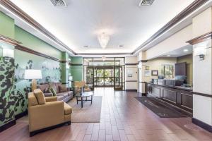 a living room with a couch and a table at Sleep Inn & Suites Smithfield near I-95 in Smithfield