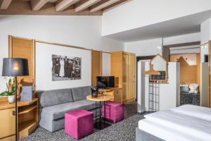Postel nebo postele na pokoji v ubytování Geniesserhotel Rauter