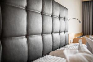 Postel nebo postele na pokoji v ubytování Geniesserhotel Rauter