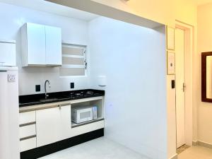 Køkken eller tekøkken på LOFT Av Brasil bem localizado e Economico com Wi-Fi + 13 billeder