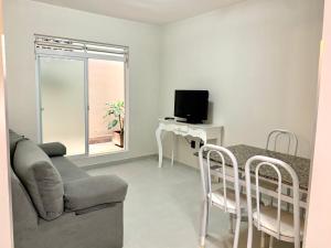 Et tv og/eller underholdning på LOFT Av Brasil bem localizado e Economico com Wi-Fi