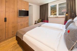 Voodi või voodid majutusasutuse Lifesport Hotel Hechenmoos toas